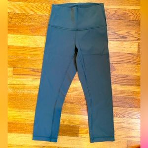 Like new, size 4 cropped, lululemon wunder under leggings in olive green